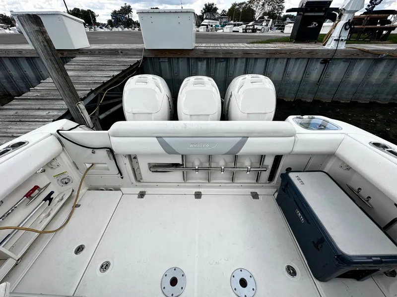 Slide: The Image of 2014 Boston Whaler 370 Outrage docked at a marina. - 12