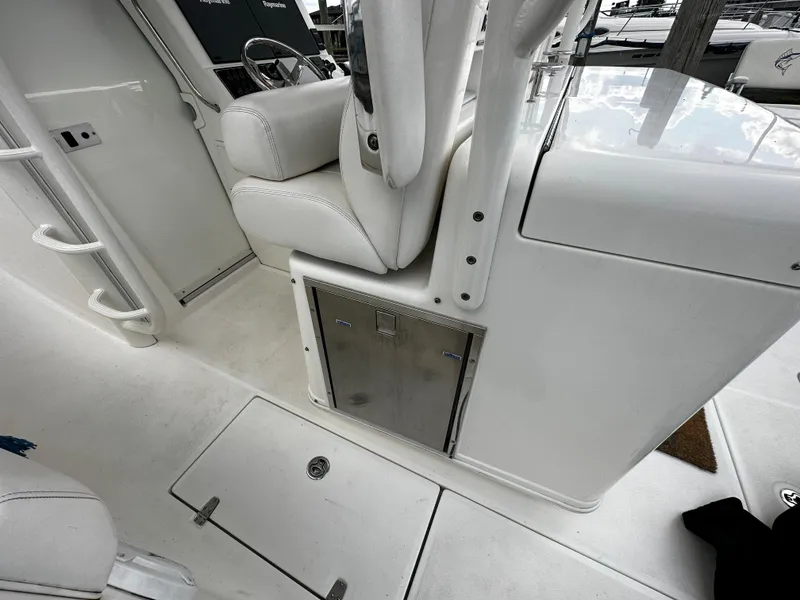 Slide: The Image of 2014 Boston Whaler 370 Outrage engine compartment with electrical components and wiring. - 17