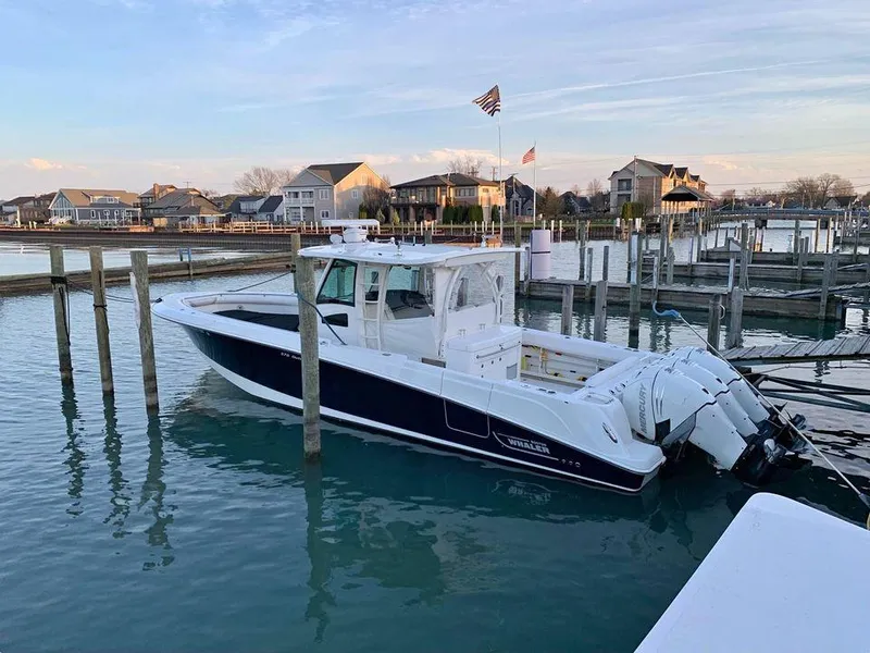 Slide: The Image of 2014 Boston Whaler 370 Outrage docked in a marina. - 4