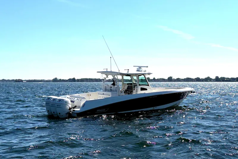 Slide: The Image of 2014 Boston Whaler 370 Outrage boat in indoor storage facility. - 8