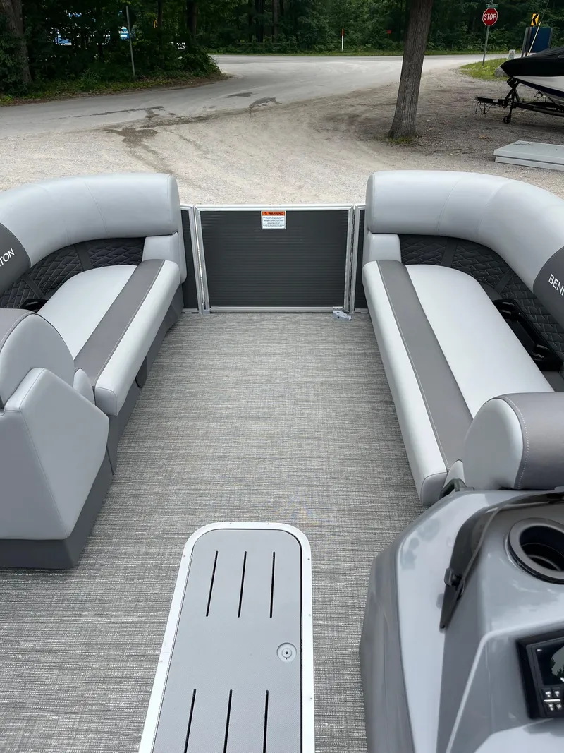 Slide: The Image of 2024 Bennington 22 SS SPS pontoon boat interior with gray seating and flooring. - 10