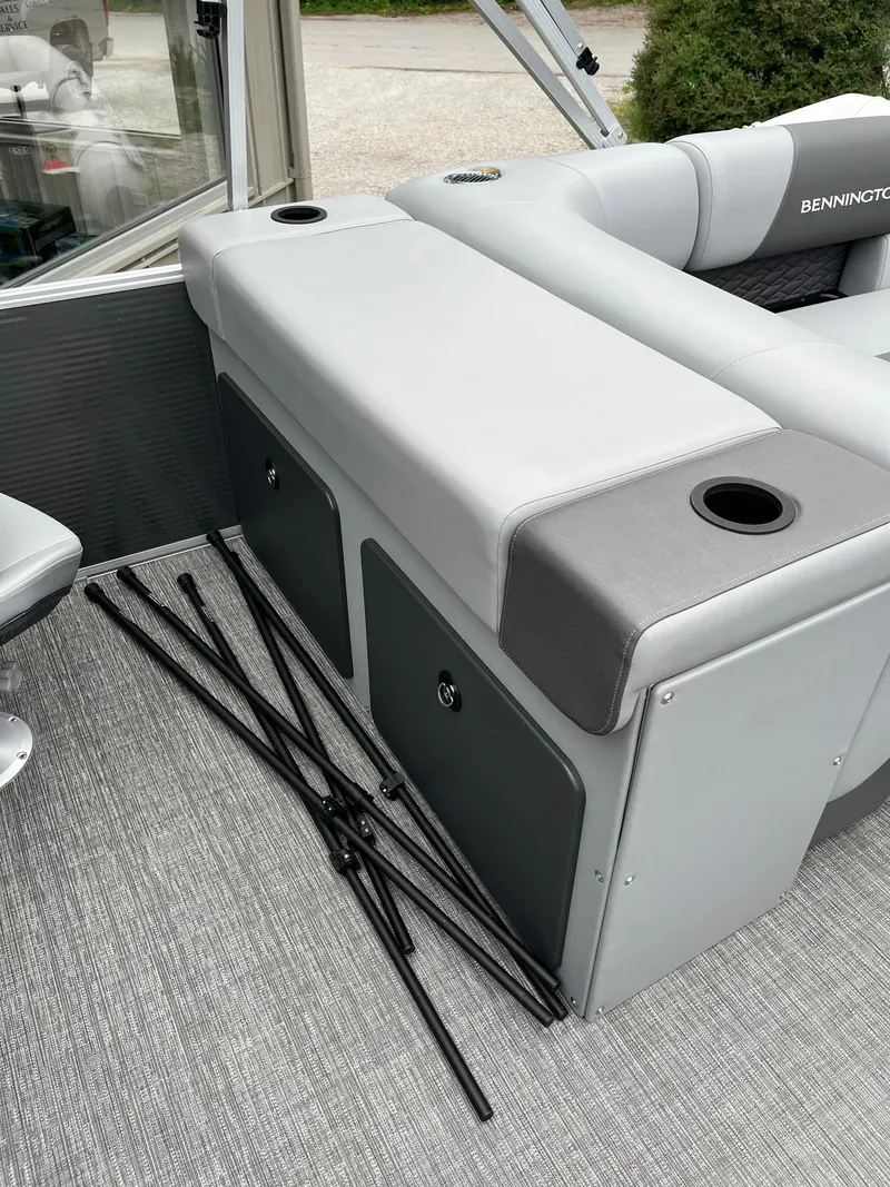 Slide: The Image of 2024 Bennington 22 SS SPS boat interior with gray seating and cup holders. - 5