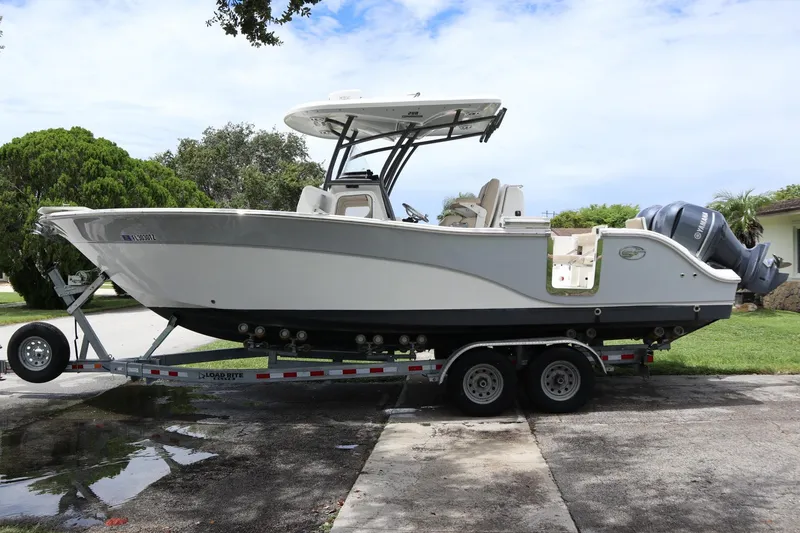 Slide: The Image of 2016 Sea Fox Commander 288 boat on trailer, parked outdoors. - 1