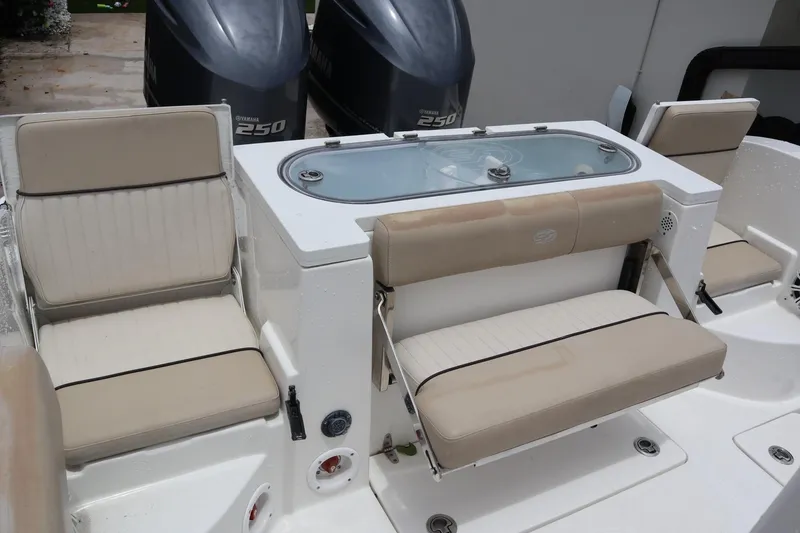 Slide: The Image of 2016 Sea Fox Commander 288 boat interior with seating and Yamaha 250 engines. - 10