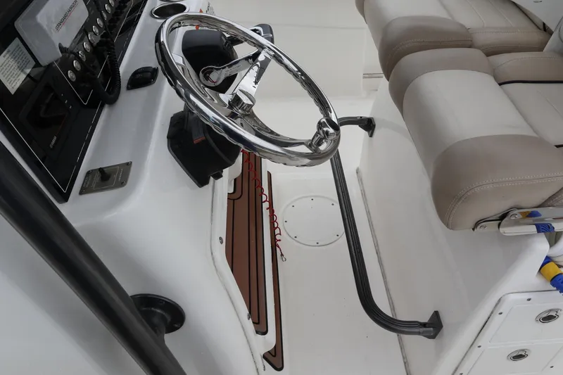 Slide: The Image of 2016 Sea Fox Commander 288 boat helm with steering wheel and seating. - 14