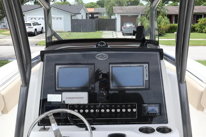 Slide: The Image of 2016 Sea Fox Commander 288 dashboard with dual screens and control panel. - 15
