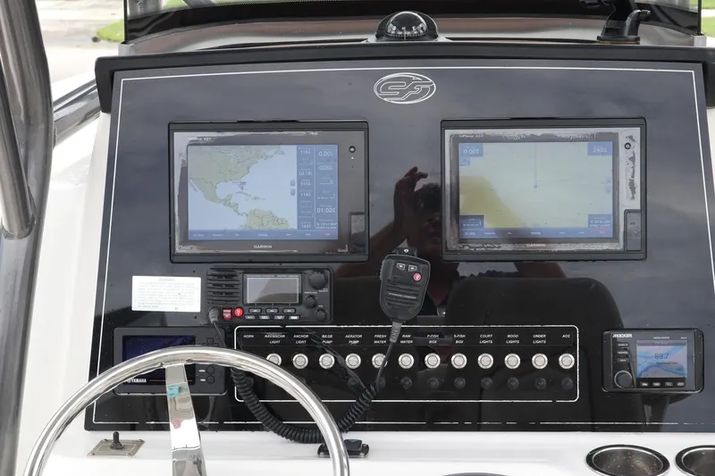 Slide: The Image of 2016 Sea Fox Commander 288 dashboard with navigation screens and control panel. - 16