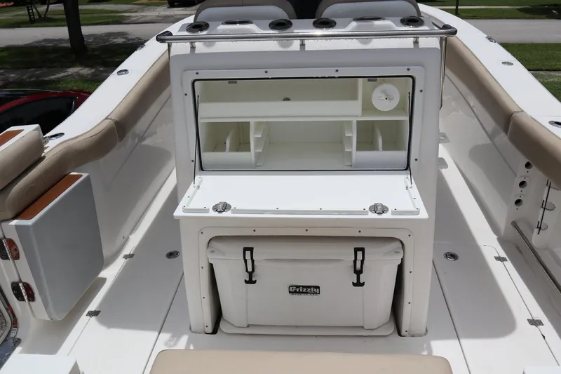 Slide: The Image of 2016 Sea Fox Commander 288 boat interior with storage and cooler. - 24