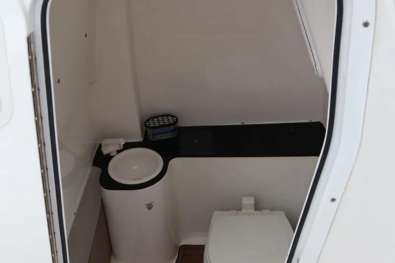 Slide: The Image of 2016 Sea Fox Commander 288 boat interior bathroom with sink and toilet. - 25