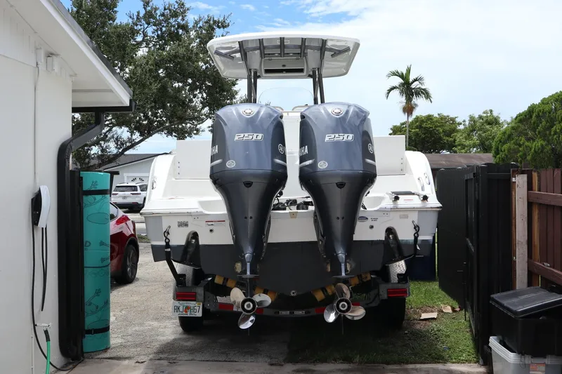 Slide: The Image of 2016 Sea Fox Commander 288 boat with dual Yamaha 250 engines parked outdoors. - 29