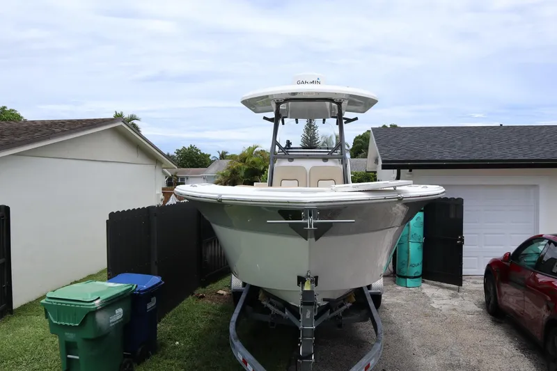 Slide: The Image of 2016 Sea Fox Commander 288 boat on trailer in residential driveway. - 3