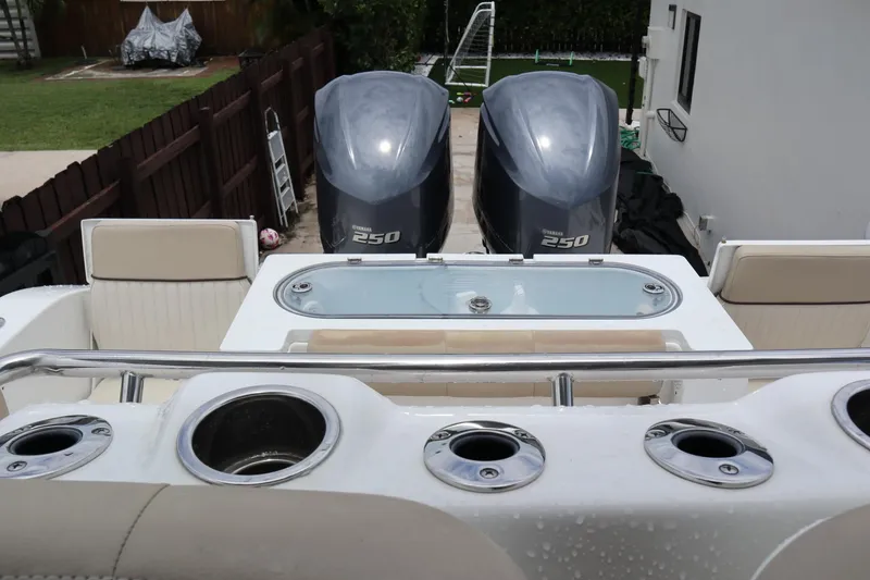Slide: The Image of 2016 Sea Fox Commander 288 boat with dual Yamaha 250 engines and fishing rod holders. - 30