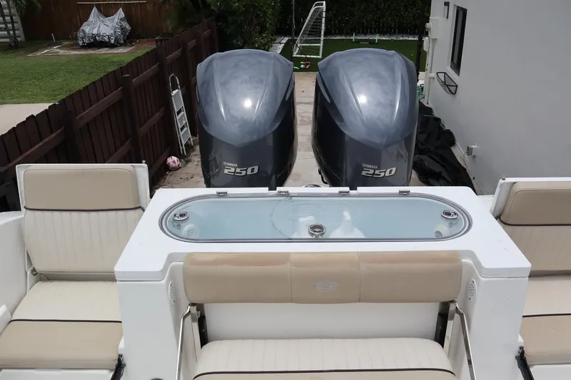 Slide: The Image of 2016 Sea Fox Commander 288 boat with twin Yamaha 250 engines and seating area. - 31