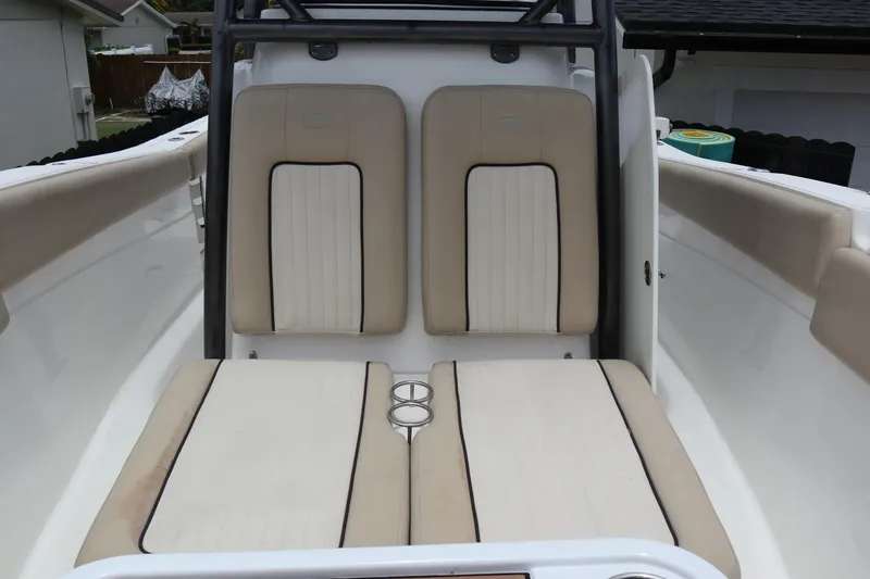 Slide: The Image of 2016 Sea Fox Commander 288 boat interior with beige seating and cup holders. - 5