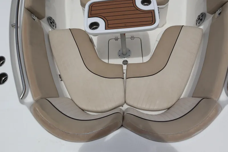 Slide: The Image of 2016 Sea Fox Commander 288 boat interior with beige seating and a central table. - 6
