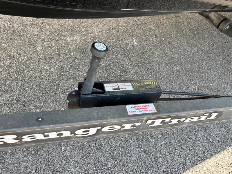 Slide: The Image of Trailer hitch of 2021 Ranger 621cFS Pro on asphalt surface. - 2