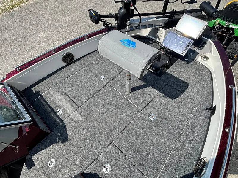 Slide: The Image of 2021 Ranger 621cFS Pro boat deck with navigation equipment and carpeted flooring. - 6