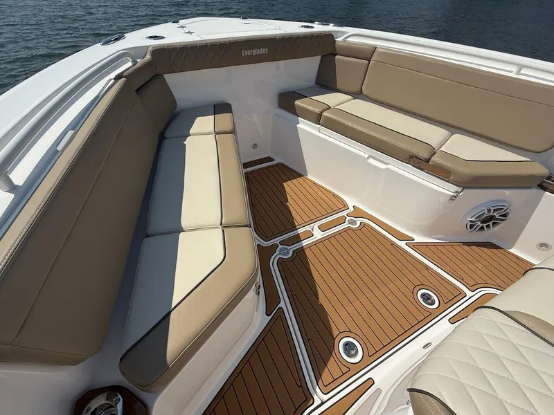 Slide: The Image of Luxurious seating on 2023 Everglades 395 Center Console boat with teak flooring. - 29