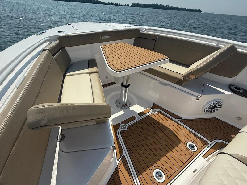 Slide: The Image of Luxurious seating area on 2023 Everglades 395 Center Console boat with wood accents. - 30