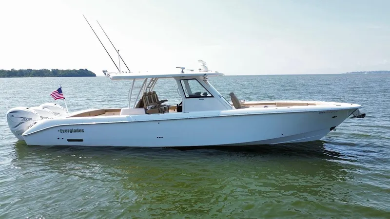 Slide: The Image of 2023 Everglades 395 Center Console boat on calm water, side view. - 5