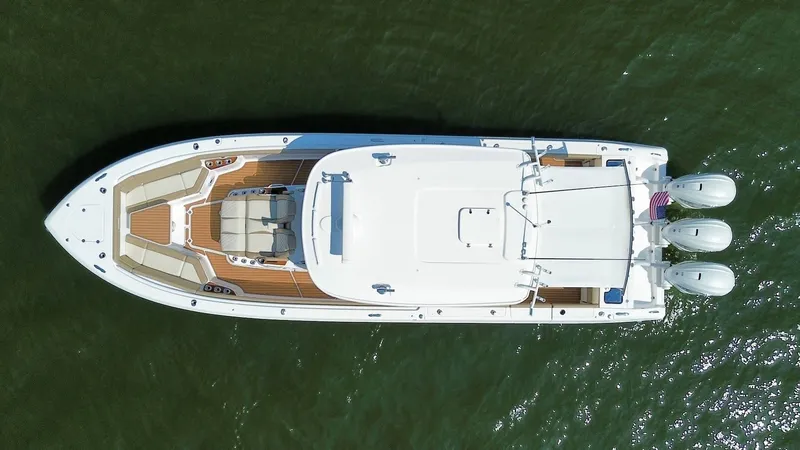 Slide: The Image of 2023 Everglades 395 Center Console boat, aerial view, on water. - 7