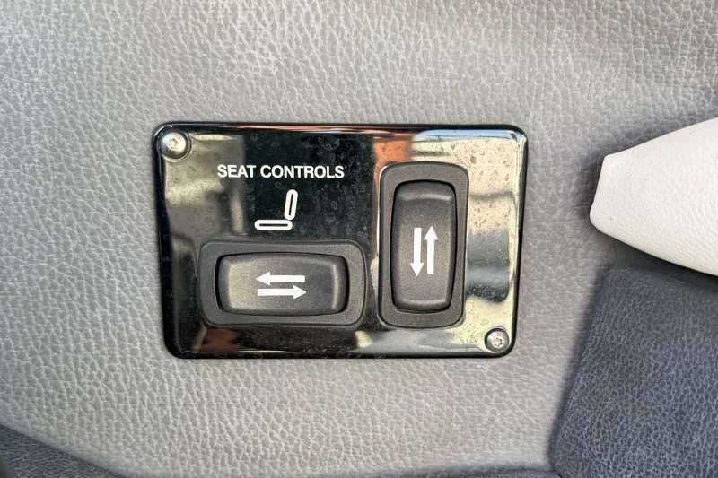 Slide: The Image of Seat controls panel on 2017 Regal 29 OBX boat, featuring adjustment switches. - 14