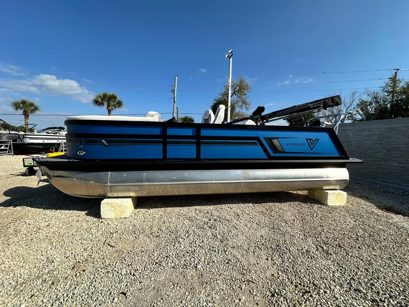 The Image of 2022 Viaggio Diamante 21S pontoon boat on display under clear blue sky. - 1