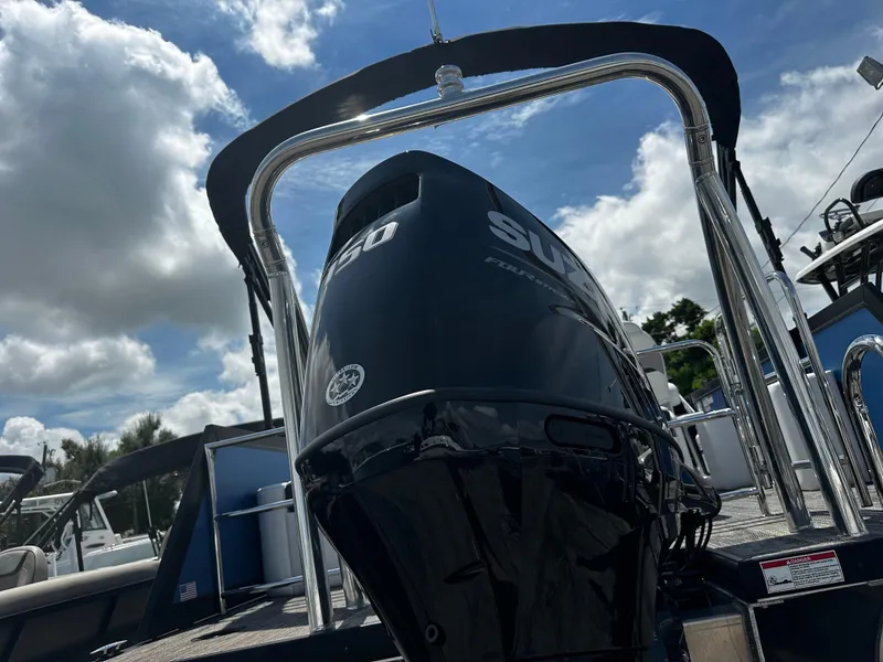 Slide: The Image of 2022 Viaggio Diamante 21S boat with Suzuki outboard motor, under a partly cloudy sky. - 10