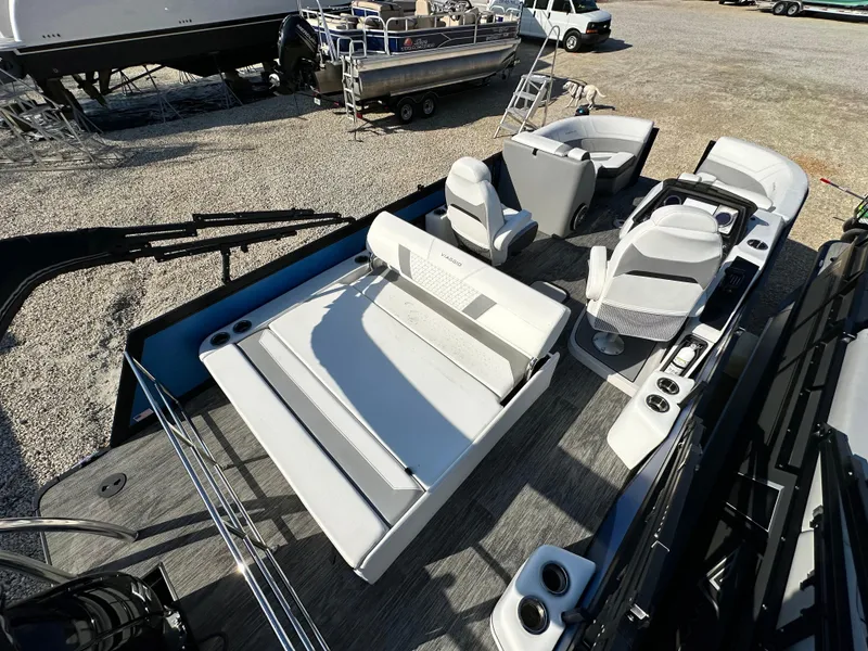 Slide: The Image of 2022 Viaggio Diamante 21S boat interior with seating and control console, parked on gravel. - 4