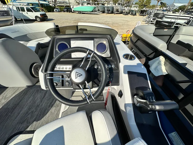 Slide: The Image of Cockpit of 2022 Viaggio Diamante 21S boat with steering wheel and control panel. - 8
