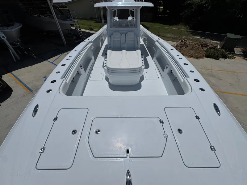 Slide: The Image of 2026 Invincible 46 Catamaran deck view with seating and storage compartments. - 17