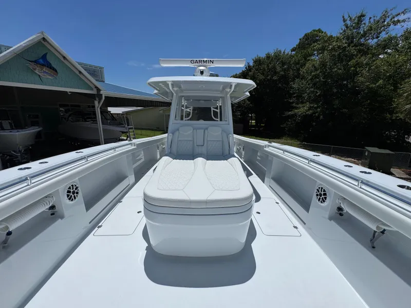 Slide: The Image of 2026 Invincible 46 Catamaran with spacious deck and seating, featuring Garmin equipment. - 19