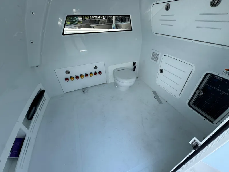 Slide: The Image of Interior of 2026 Invincible 46 Catamaran featuring a modern marine bathroom setup. - 24