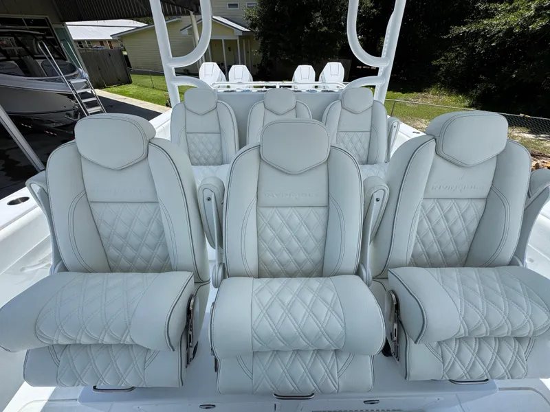 Slide: The Image of Luxurious seating on 2026 Invincible 46 Catamaran, featuring elegant white upholstery and diamond stitching. - 27