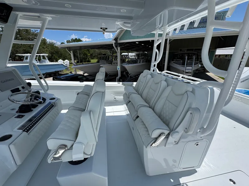 Slide: The Image of Luxurious seating on 2026 Invincible 46 Catamaran, featuring modern design and advanced navigation equipment. - 29