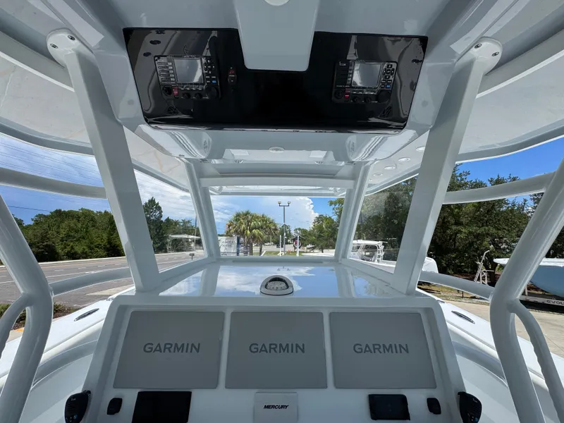 Slide: The Image of 2026 Invincible 46 Catamaran helm with Garmin displays and navigation equipment. - 32