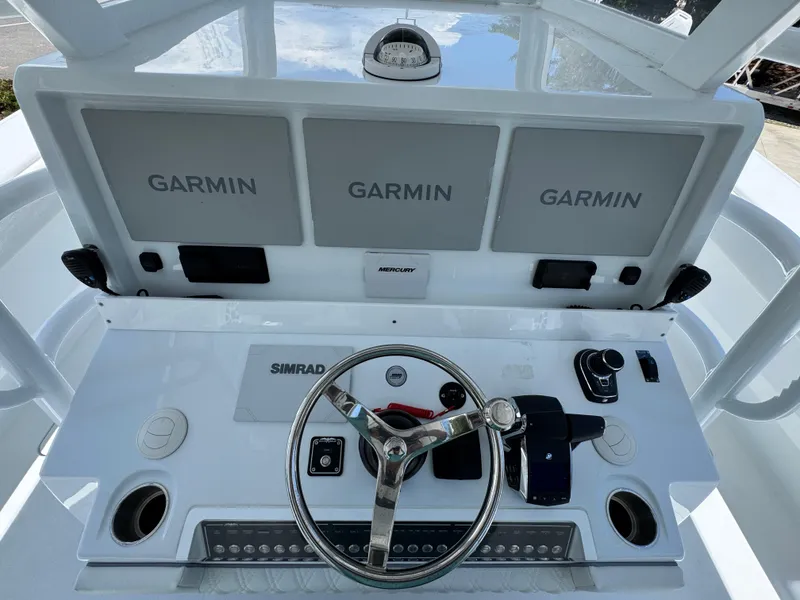 Slide: The Image of Helm of 2026 Invincible 46 Catamaran with Garmin displays and Simrad controls. - 33