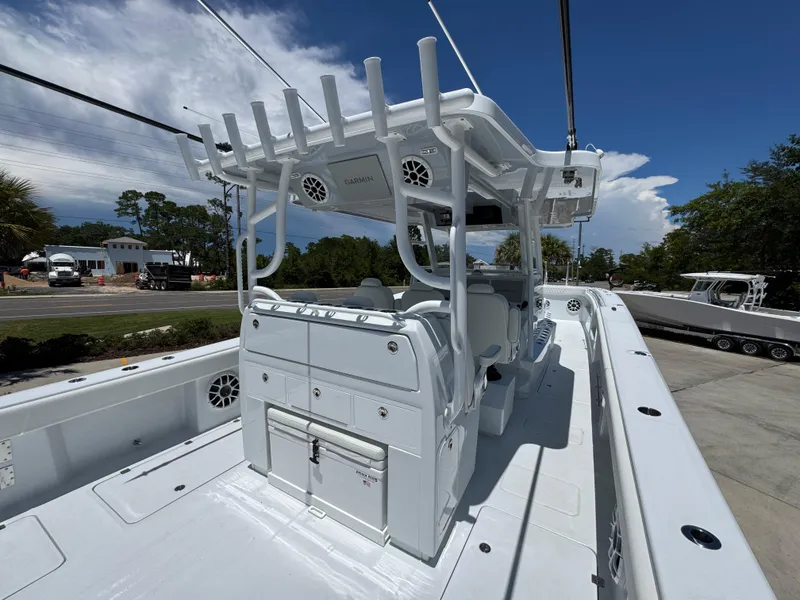 Slide: The Image of 2026 Invincible 46 Catamaran with sleek design and spacious deck under clear blue sky. - 36