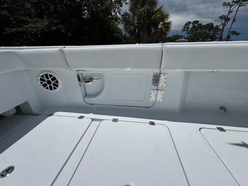 Slide: The Image of 2026 Invincible 46 Catamaran deck with storage compartments and speaker. - 37