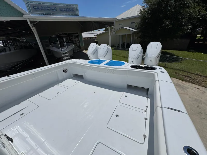 Slide: The Image of 2026 Invincible 46 Catamaran at Grander Marine dealership, featuring spacious deck and powerful engines. - 38