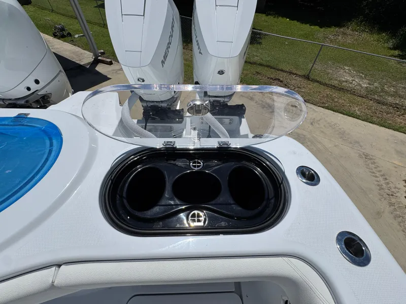 Slide: The Image of Invincible 46 Catamaran 2026 with dual Mercury engines and open storage compartment. - 41