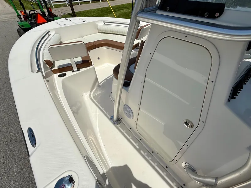 Slide: The Image of 2019 Sea Born LX21 Center Console boat interior with seating and storage. - 12