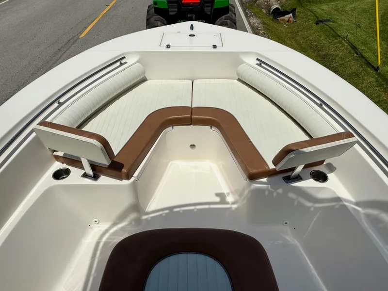 Slide: The Image of 2019 Sea Born LX21 Center Console boat with white and brown seating arrangement. - 14