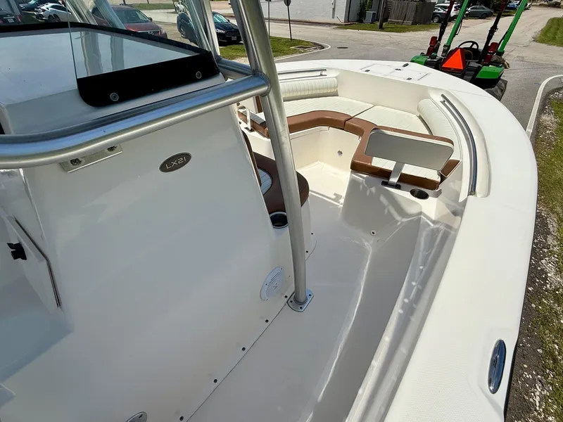 Slide: The Image of 2019 Sea Born LX21 Center Console boat interior with seating and console view. - 15