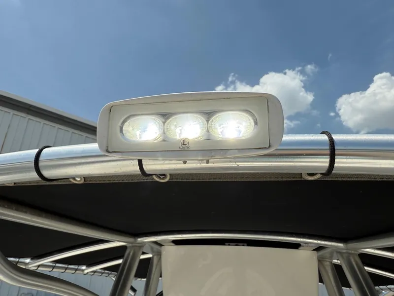 Slide: The Image of LED light on 2019 Sea Born LX21 Center Console boat under clear sky. - 21