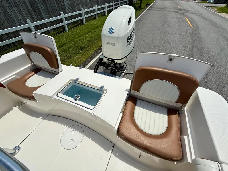 Slide: The Image of 2019 Sea Born LX21 Center Console boat with Suzuki outboard motor and seating. - 7