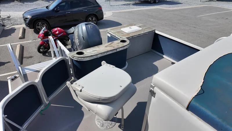 Slide: The Image of 2012 G3 SunCatcher LV 228 Fish & Cruise boat interior with seating and motor. - 3