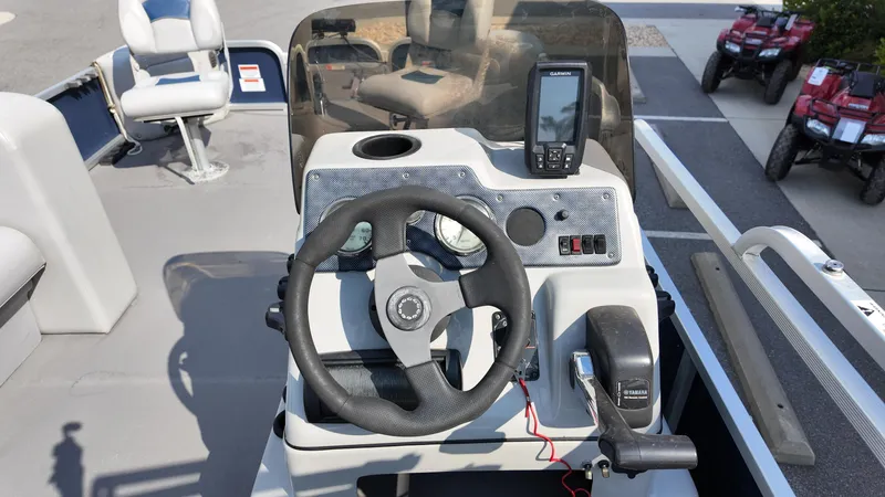 Slide: The Image of 2012 G3 SunCatcher LV 228 Fish & Cruise boat dashboard with steering wheel and Garmin device. - 5