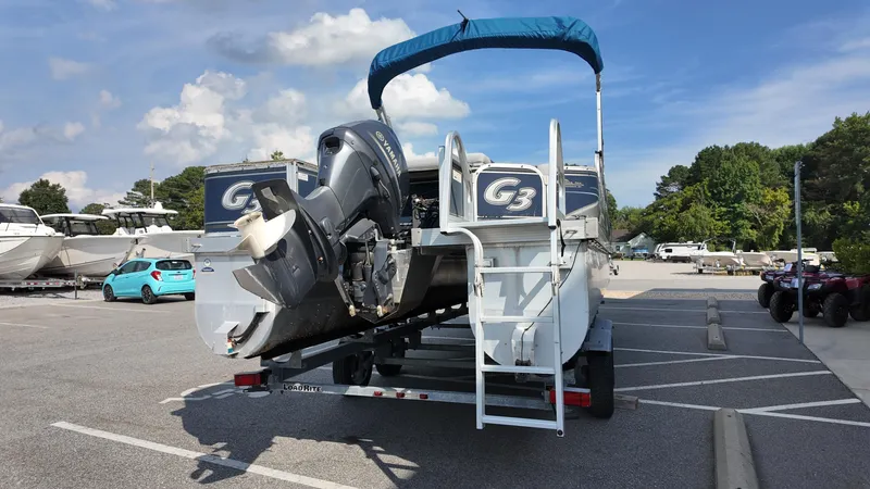 Slide: The Image of 2012 G3 SunCatcher LV 228 Fish & Cruise boat on trailer in parking lot. - 8