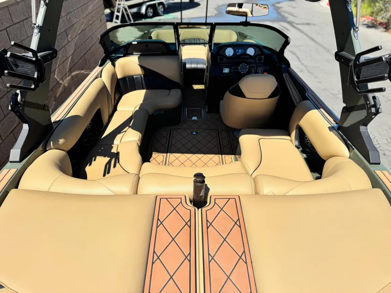 Slide: The Image of Luxurious interior of 2022 MB F21 Tomcat boat with tan leather seating and modern dashboard. - 13